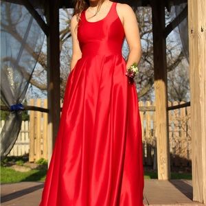 Beautiful Red Prom Dress with Pockets. Size 5 Wore twice. Has been dry cleaned.